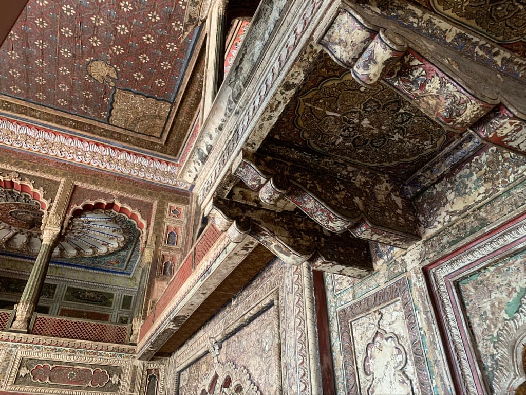 Ceiling medallions in red, green, and gold