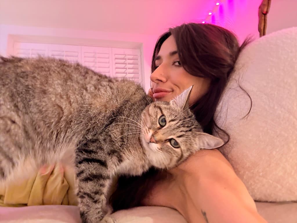 Xiao stretched across Jenn on a couch.